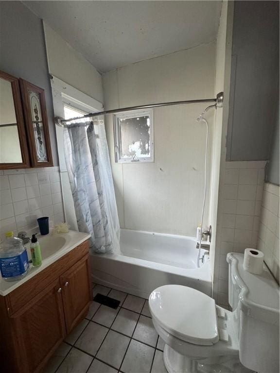 127 Maryland St, Rochester, NY 14613 - full bathroom featuring tile walls, toilet, tile patterned flooring, vanity, and shower / bathtub combination with curtain