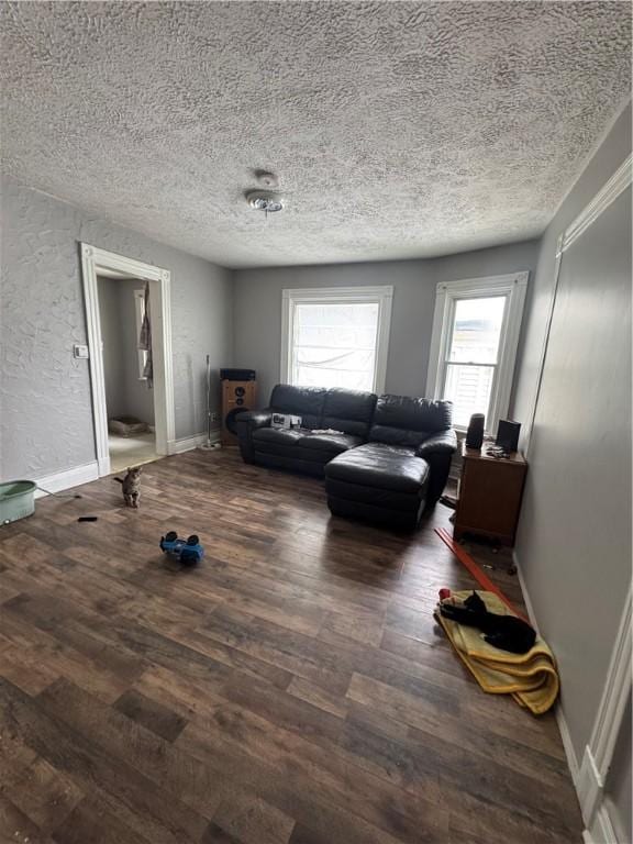 127 Maryland St, Rochester, NY 14613 - living room with a textured ceiling, wood finished floors, and baseboards