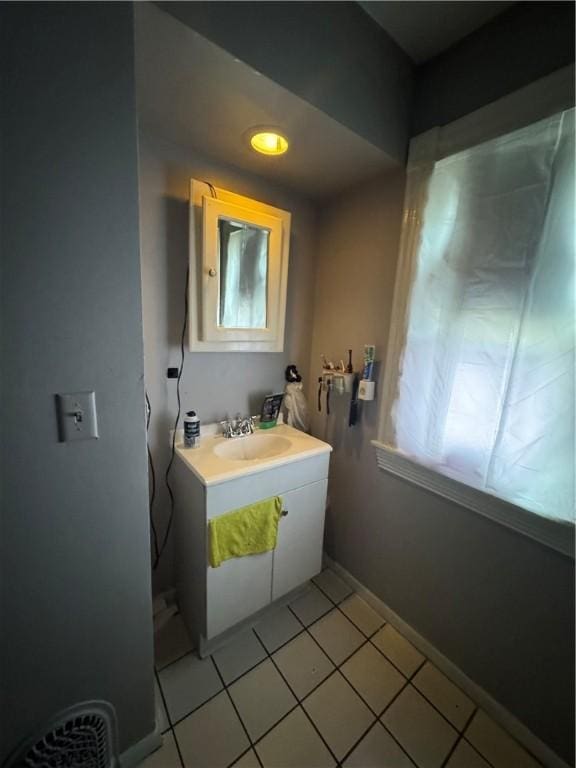 127 Maryland St, Rochester, NY 14613 - bathroom featuring vanity, tile patterned flooring, and baseboards