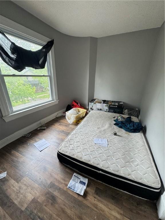 127 Maryland St, Rochester, NY 14613 - bedroom with baseboards, wood finished floors, and a textured ceiling