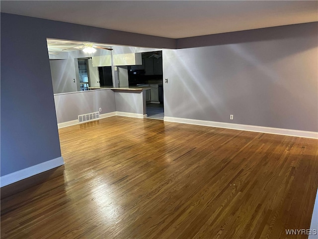90 Nadon Pl, Tonawanda-Town, NY 14150 - unfurnished living room featuring dark wood-style flooring, baseboards, and ceiling fan