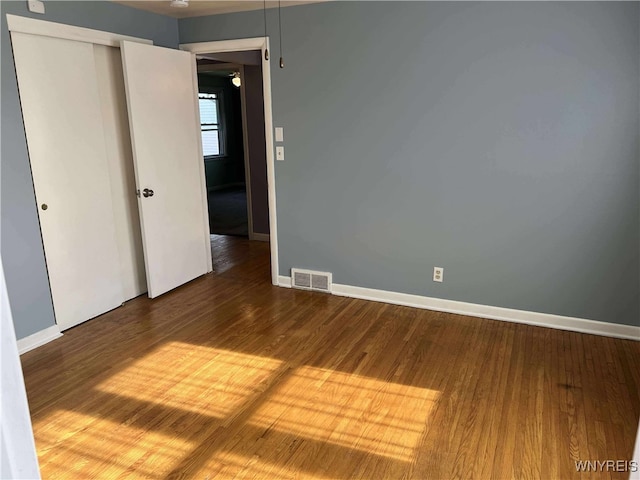 90 Nadon Pl, Tonawanda-Town, NY 14150 - unfurnished bedroom with wood finished floors, baseboards, and a closet