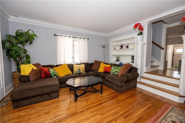 47 Winston Rd, Buffalo, NY 14216 - living area with wood finished floors, stairs, crown molding, plenty of natural light, and built in features