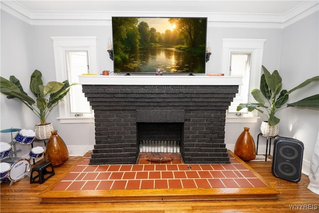 47 Winston Rd, Buffalo, NY 14216 - detailed view of ornamental molding, baseboards, wood finished floors, and a brick fireplace