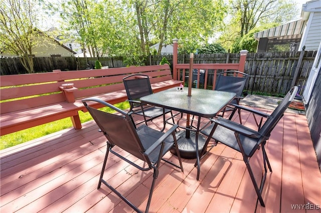 47 Winston Rd, Buffalo, NY 14216 - wooden terrace with outdoor dining area and a fenced backyard