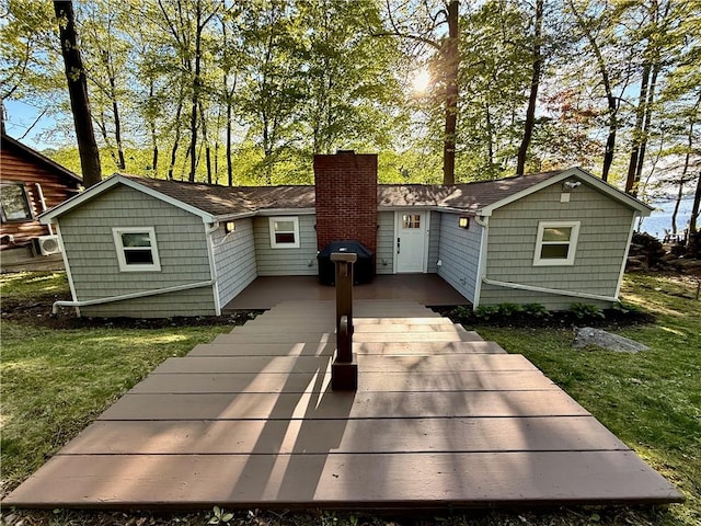 8119 Martin Rd, Wolcott, NY 14590 - rear view of property featuring a chimney and a lawn