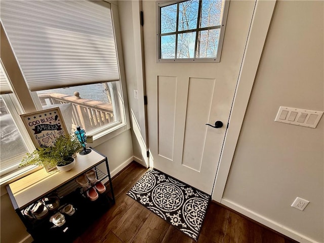 8119 Martin Rd, Wolcott, NY 14590 - entryway with dark wood-style flooring and baseboards