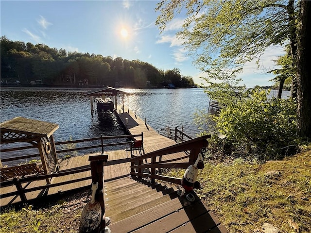8119 Martin Rd, Wolcott, NY 14590 - dock area featuring a water view and a forest view