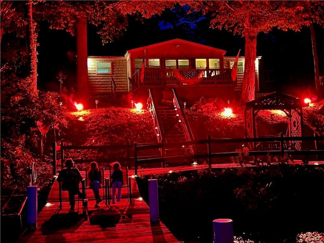 8119 Martin Rd, Wolcott, NY 14590 - surrounding community featuring a wooden deck, stairway, a dock, and an outdoor fire pit