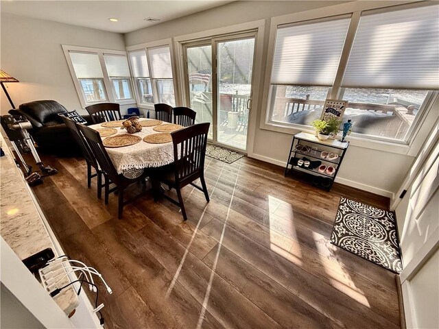 8119 Martin Rd, Wolcott, NY 14590 - dining room with wood finished floors, baseboards, and recessed lighting