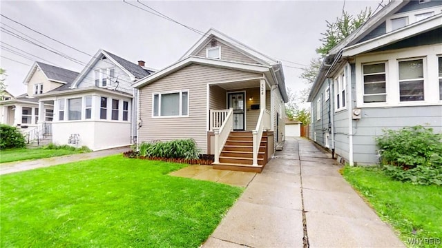 524 Lasalle Ave, Buffalo, NY 14215 - bungalow-style home with an outbuilding and a front lawn