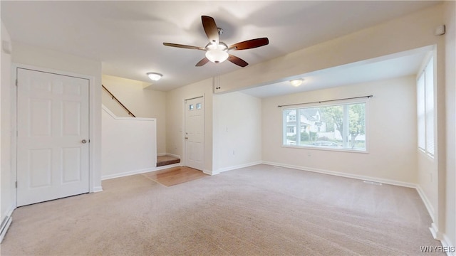 524 Lasalle Ave, Buffalo, NY 14215 - carpeted empty room featuring a ceiling fan, stairway, and baseboards