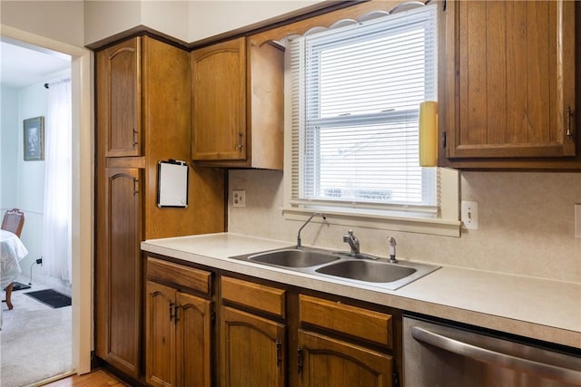 182 E Pulteney St, Corning City, NY 14830 - kitchen featuring a sink, stainless steel dishwasher, brown cabinetry, and light countertops