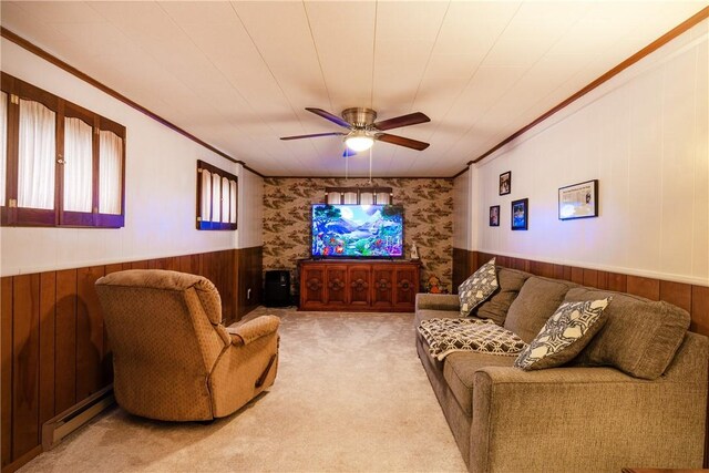 182 E Pulteney St, Corning City, NY 14830 - carpeted living room featuring a ceiling fan, a wainscoted wall, wood walls, wallpapered walls, and ornamental molding