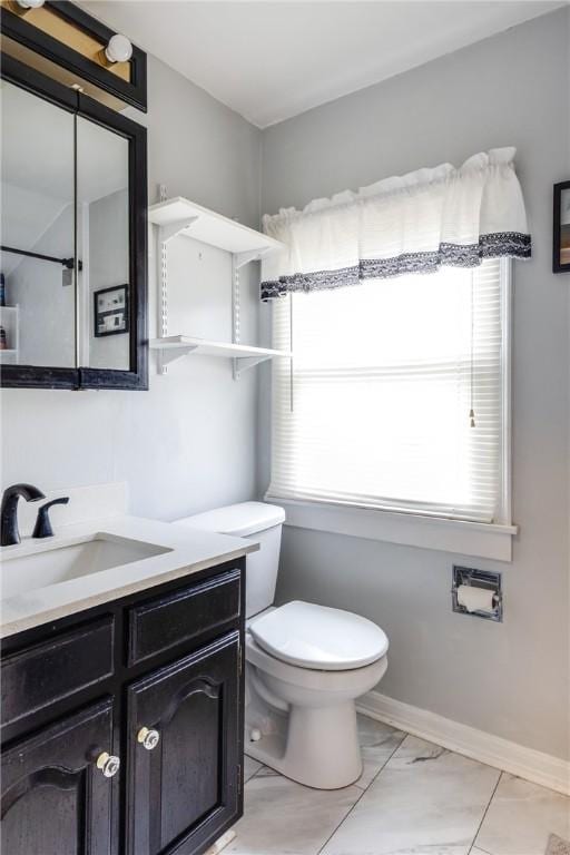 182 E Pulteney St, Corning City, NY 14830 - bathroom featuring plenty of natural light, vanity, toilet, and marble finish floors