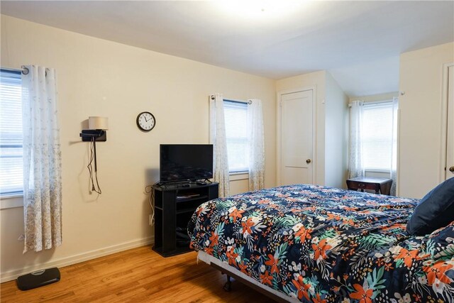 182 E Pulteney St, Corning City, NY 14830 - bedroom featuring light wood-style flooring, multiple windows, and baseboards