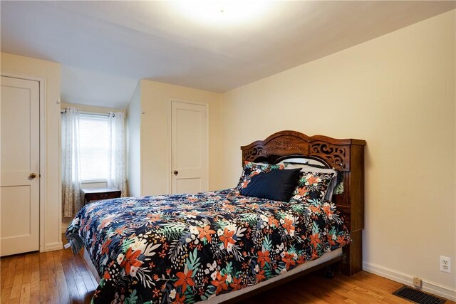 182 E Pulteney St, Corning City, NY 14830 - bedroom with wood-type flooring and baseboards