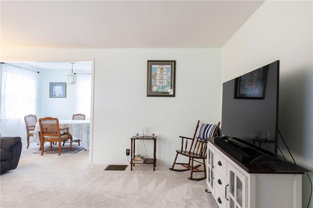182 E Pulteney St, Corning City, NY 14830 - sitting room featuring light colored carpet and a chandelier