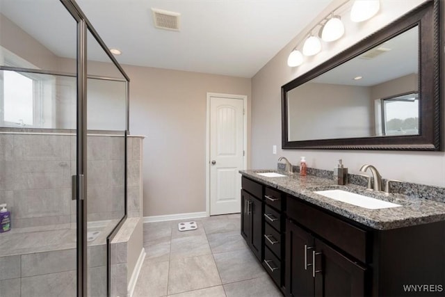17 Knoche Way, Orchard Park, NY 14127 - bathroom featuring double vanity, a stall shower, baseboards, and tile patterned flooring