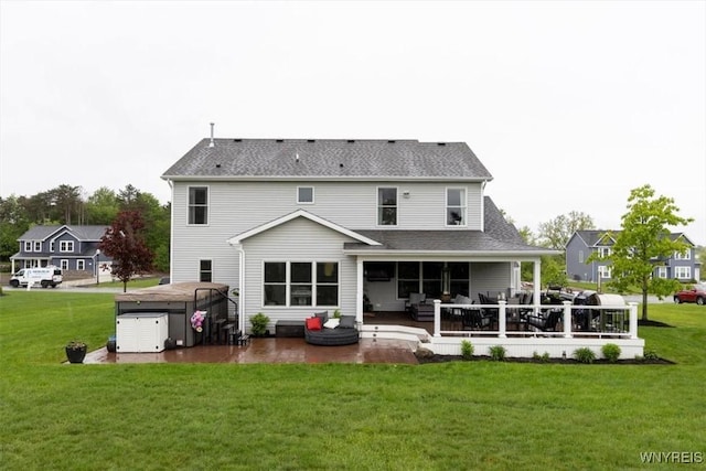 17 Knoche Way, Orchard Park, NY 14127 - back of property featuring a patio, a yard, a hot tub, and a shingled roof