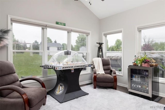 17 Knoche Way, Orchard Park, NY 14127 - sitting room with vaulted ceiling, ceiling fan, wood finished floors, and baseboards