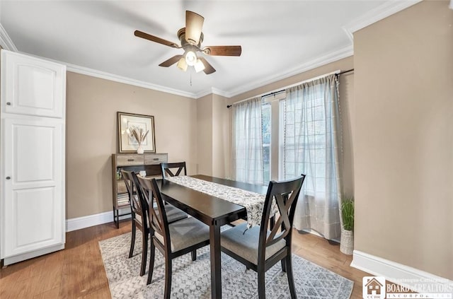 88 Summit Ave, Orchard Park, NY 14127 - dining area featuring baseboards, ceiling fan, crown molding, and wood finished floors