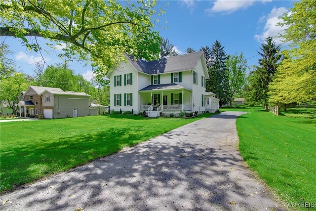 7263 Quaker Rd, Orchard Park, NY 14127 - view of front of home featuring covered porch, a front yard, and asphalt driveway