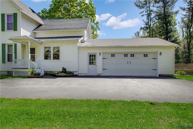 7263 Quaker Rd, Orchard Park, NY 14127 - view of front of home featuring an attached garage, driveway, and roof with shingles