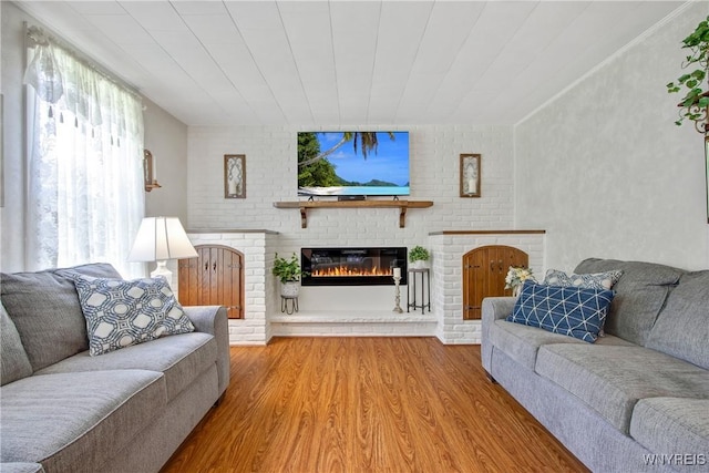 7263 Quaker Rd, Orchard Park, NY 14127 - living area with a brick fireplace and wood finished floors