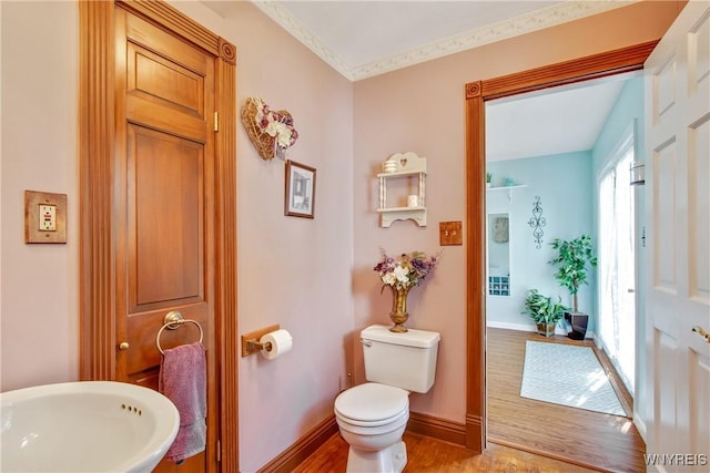 7263 Quaker Rd, Orchard Park, NY 14127 - half bathroom with toilet, wood finished floors, baseboards, and a sink