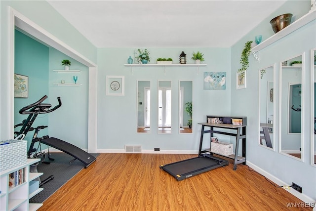 7263 Quaker Rd, Orchard Park, NY 14127 - workout area with wood finished floors and baseboards