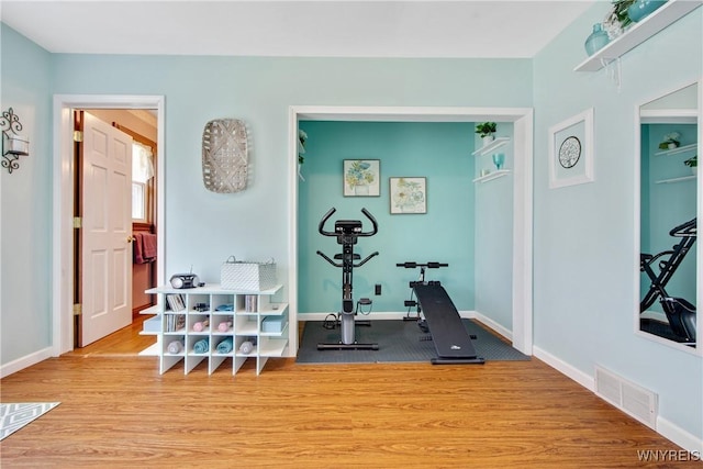 7263 Quaker Rd, Orchard Park, NY 14127 - exercise room with wood finished floors and baseboards