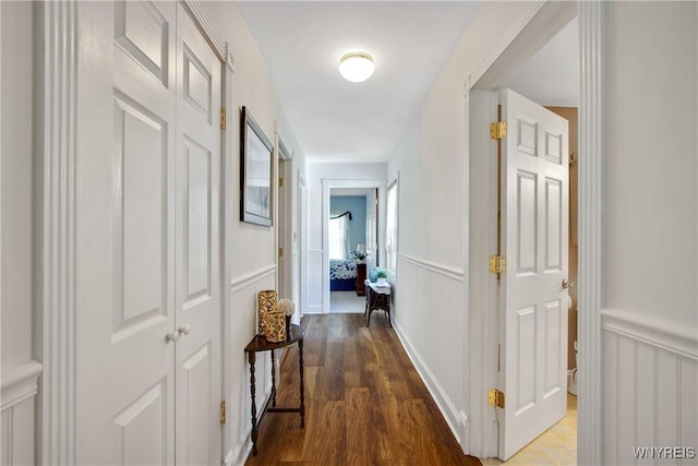 7263 Quaker Rd, Orchard Park, NY 14127 - corridor with a decorative wall, wood finished floors, and a wainscoted wall