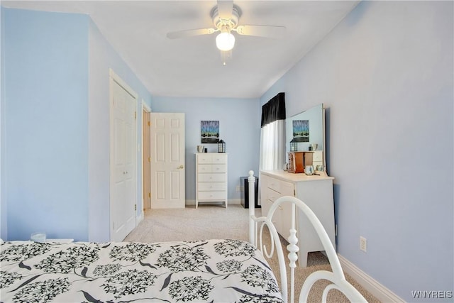 7263 Quaker Rd, Orchard Park, NY 14127 - bedroom with light carpet, baseboards, and ceiling fan