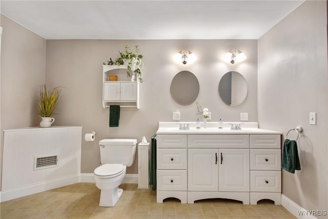 7263 Quaker Rd, Orchard Park, NY 14127 - full bath with double vanity, baseboards, and toilet