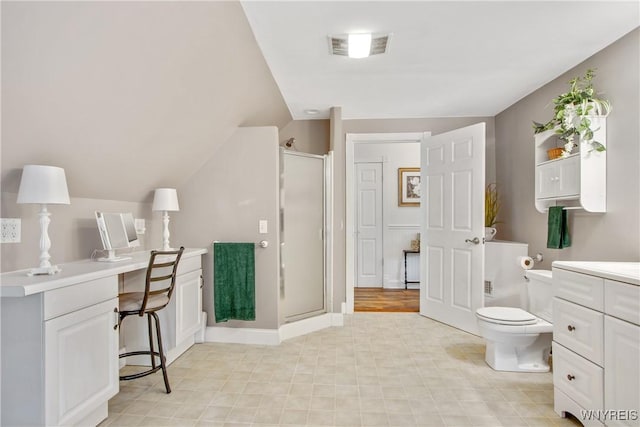 7263 Quaker Rd, Orchard Park, NY 14127 - bathroom featuring a shower stall, toilet, vanity, and lofted ceiling