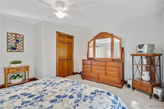 7263 Quaker Rd, Orchard Park, NY 14127 - bedroom with light carpet, baseboards, a closet, and a ceiling fan