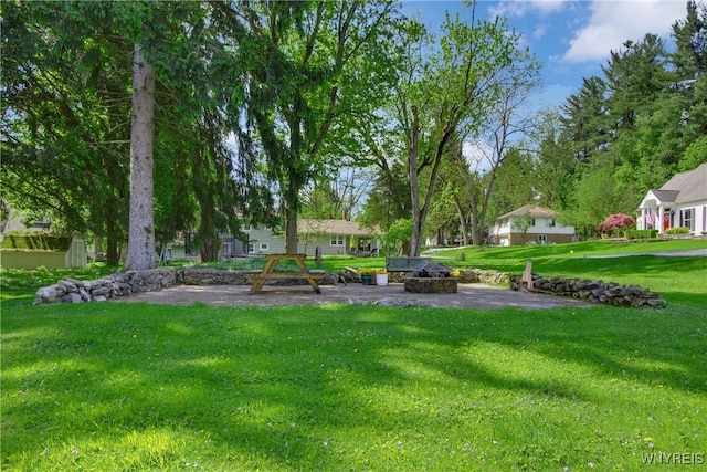 7263 Quaker Rd, Orchard Park, NY 14127 - view of green lawn with a fire pit