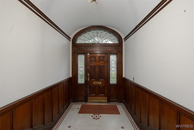 2884 Main St, Buffalo, NY 14214 - entryway with wainscoting, vaulted ceiling, and wood walls