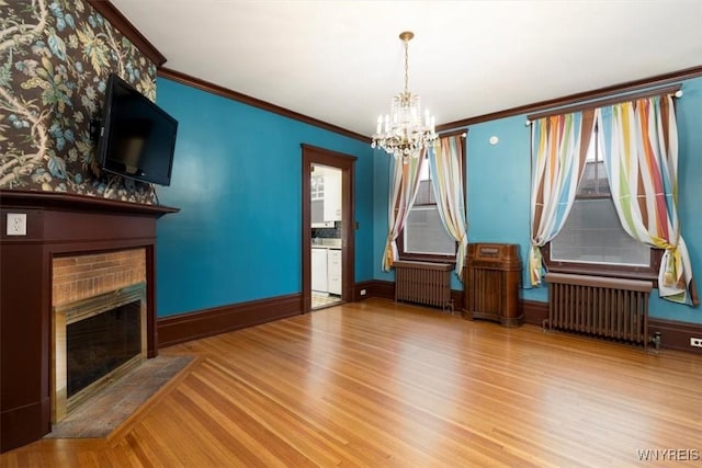 2884 Main St, Buffalo, NY 14214 - unfurnished dining area featuring radiator heating unit, a chandelier, wood finished floors, and ornamental molding