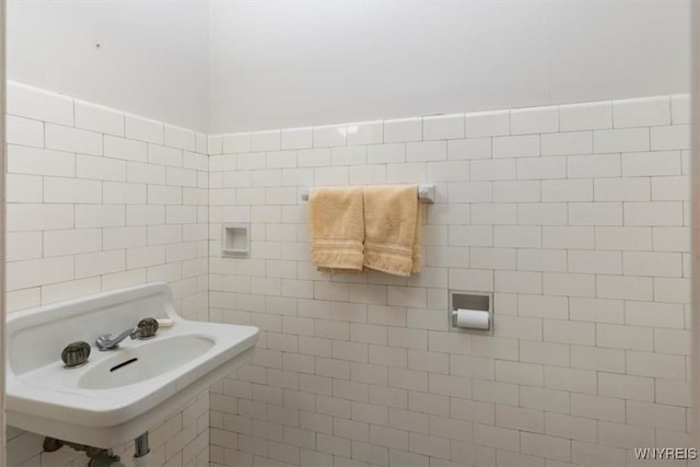 2884 Main St, Buffalo, NY 14214 - bathroom featuring tile walls and a sink