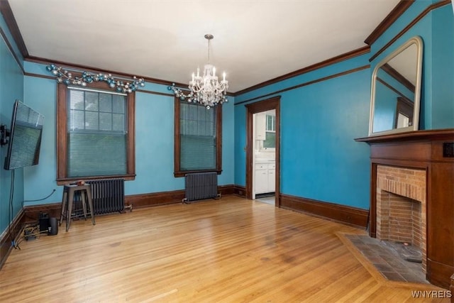 2884 Main St, Buffalo, NY 14214 - unfurnished living room featuring radiator, crown molding, a chandelier, wood finished floors, and baseboards