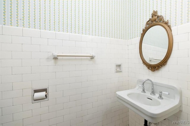 2884 Main St, Buffalo, NY 14214 - bathroom featuring wallpapered walls, tile walls, and a wainscoted wall