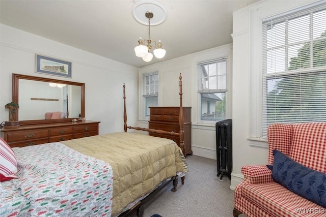 2884 Main St, Buffalo, NY 14214 - carpeted bedroom featuring a chandelier, radiator heating unit, and baseboards