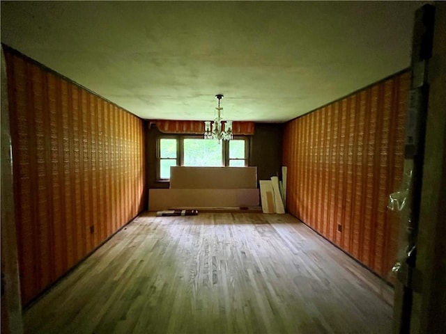 1302 Swart Rd, Middletown, NY 12455 - unfurnished dining area featuring wood finished floors and a chandelier