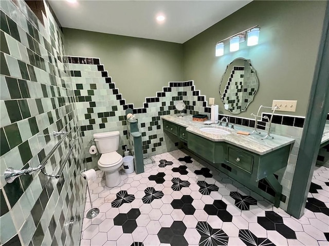 1302 Swart Rd, Middletown, NY 12455 - bathroom with tile walls, tile patterned flooring, toilet, recessed lighting, and double vanity