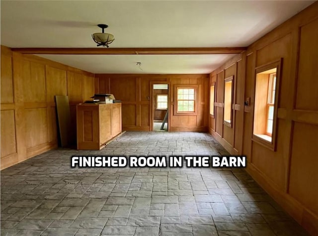 1302 Swart Rd, Middletown, NY 12455 - unfurnished living room with stone tile flooring and a decorative wall