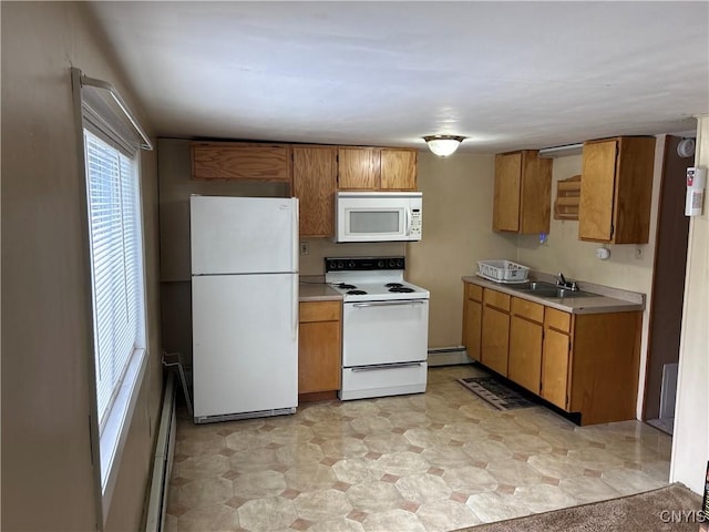 717 Lawrence St, Watertown-City, NY 13601 - kitchen with white appliances, brown cabinetry, a sink, and light countertops