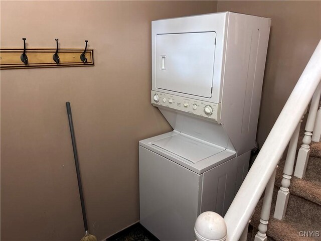 717 Lawrence St, Watertown-City, NY 13601 - laundry area featuring stacked washer and clothes dryer