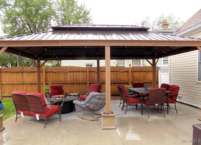 225 Fries Rd, Tonawanda-Town, NY 14150 - view of patio featuring a gazebo, a fire pit, and outdoor dining area